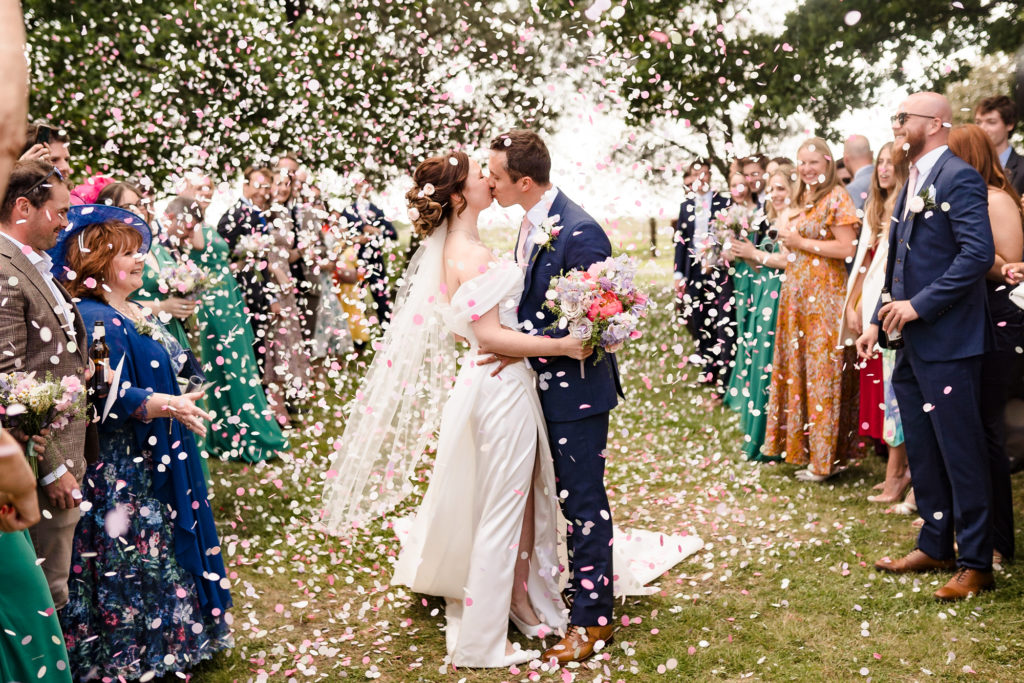 Confetti shot of a wedding couple at blake hall weddings in ongar